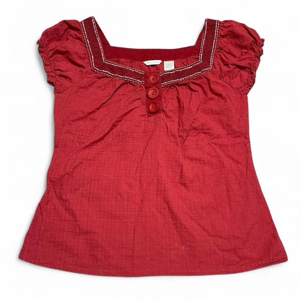 Red button up blouse with white stitching and corduroy neckline